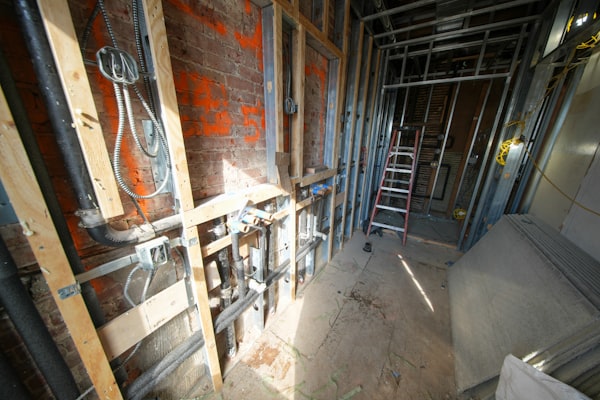 Interior construction with exposed plumbing pipes